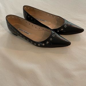 Manolo Blahnik black leather grommet-embellished flats. Size 37.